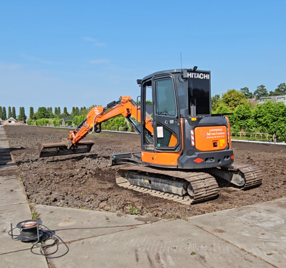 Graafmachine om de grond uit te vlakken